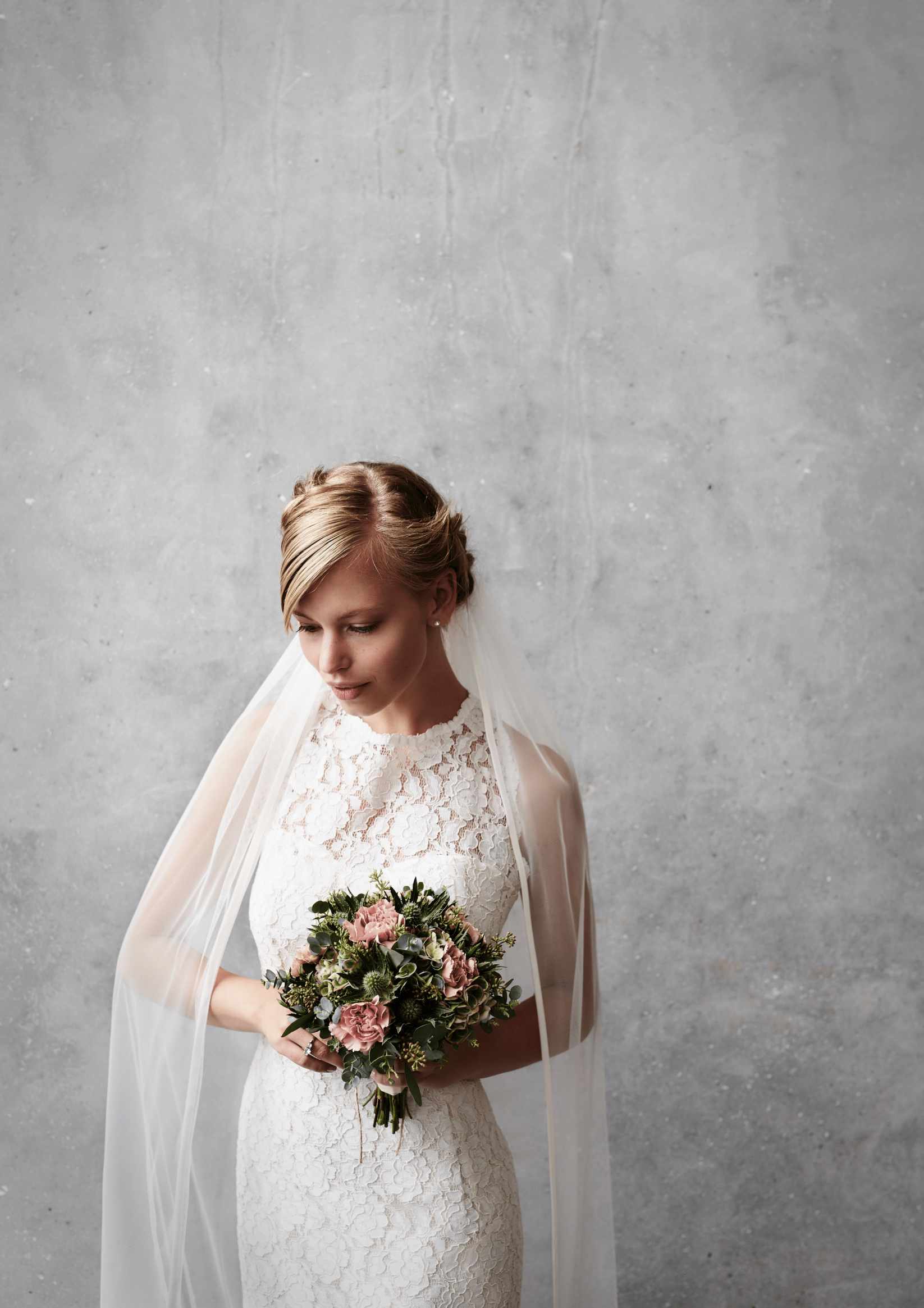 Blonde Bride in wedding dress page and flower Blonde Bride in wedding dress page and flower